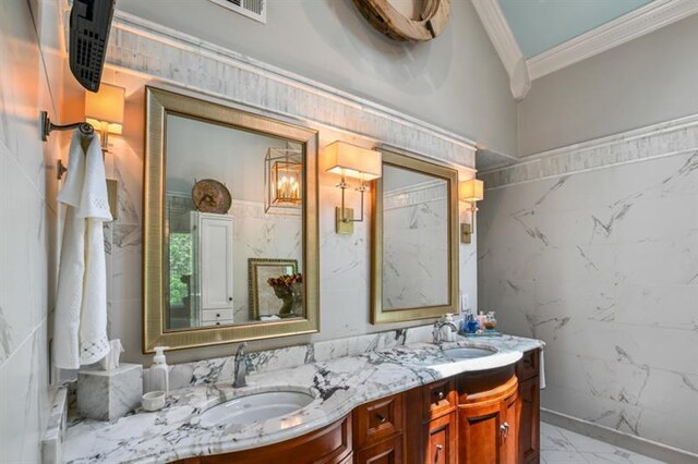 bathroom featuring a sink, double vanity, and visible vents