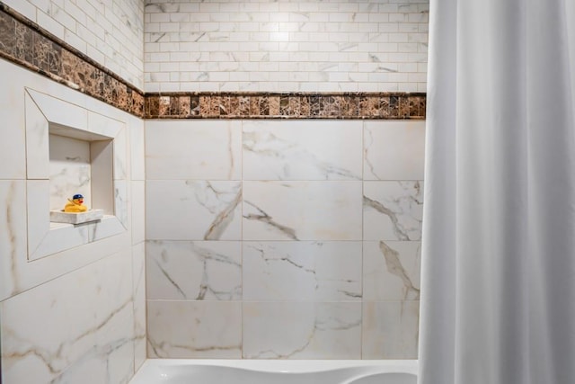 bathroom with shower / bathtub combination with curtain