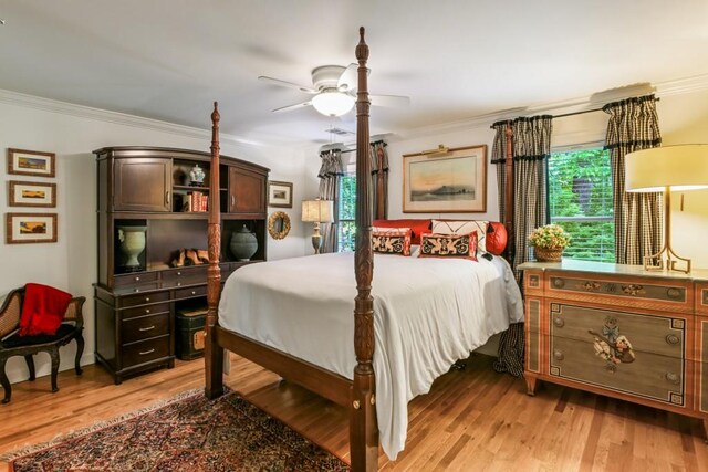 living room with ceiling fan, wood finished floors, and lofted ceiling