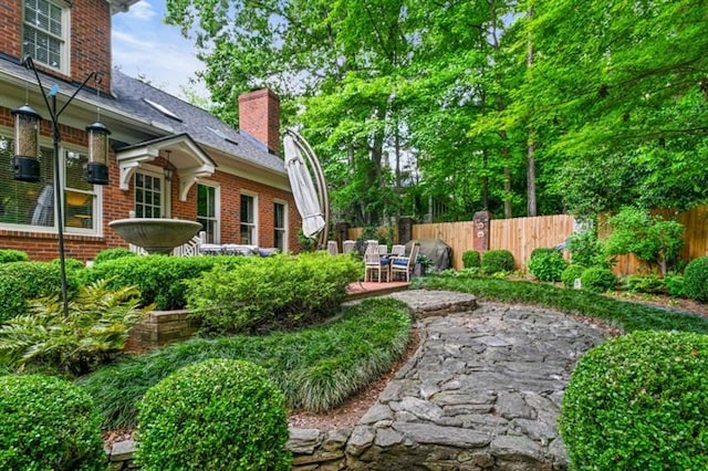 view of yard featuring a patio area and fence