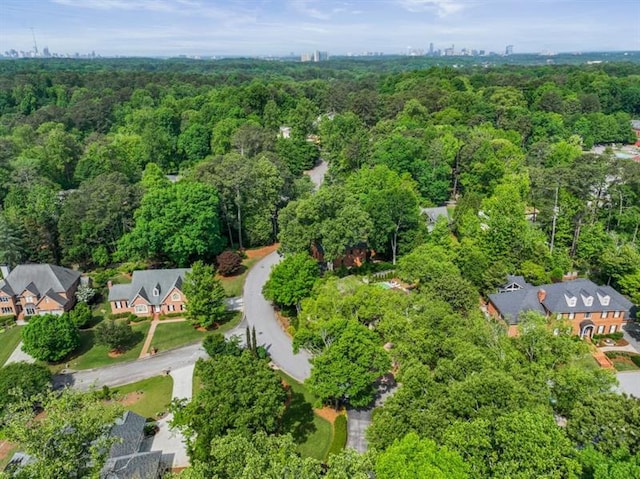 aerial view featuring a wooded view