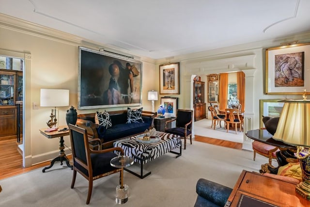 living area with crown molding and wood finished floors