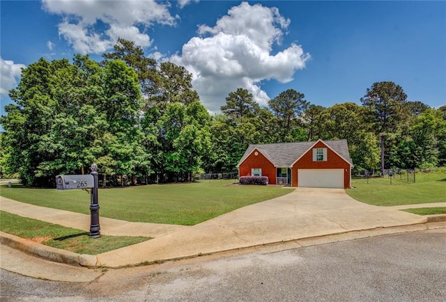 view of front facade with a front lawn, driveway, an outbuilding, and a garage