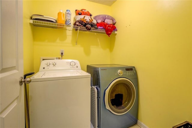 laundry area featuring washer and dryer and laundry area