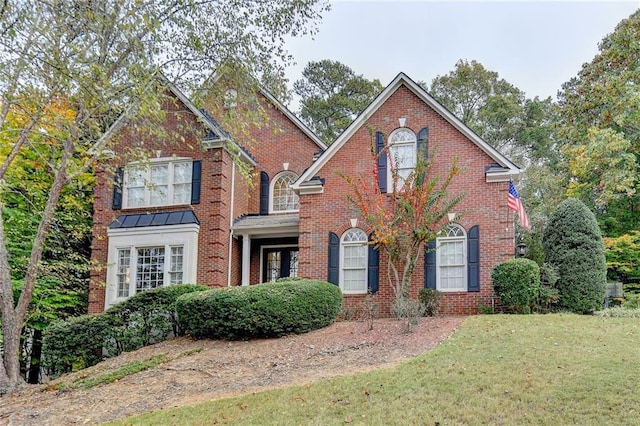 3565 Hickory Branch Trl, Suwanee, GA 30024 - view of front of property with a front yard and brick siding