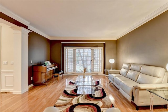 3565 Hickory Branch Trl, Suwanee, GA 30024 - living area with light wood-style flooring, ornate columns, crown molding, and baseboards