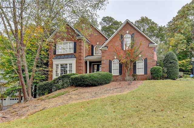3565 Hickory Branch Trl, Suwanee, GA 30024 - view of front facade with a front yard and brick siding