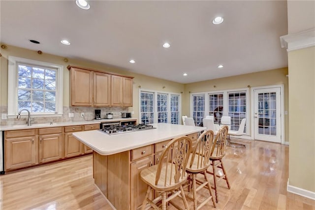 3565 Hickory Branch Trl, Suwanee, GA 30024 - kitchen with stainless steel gas stovetop, light brown cabinets, light wood-style floors, and recessed lighting