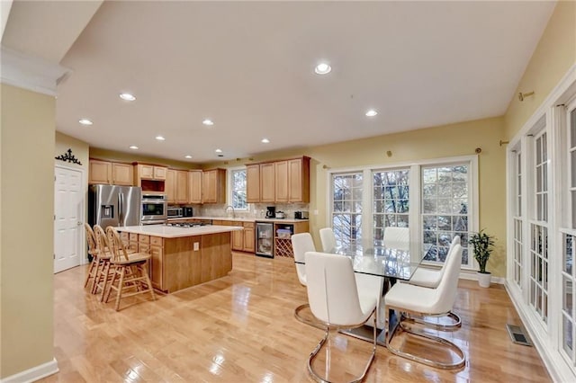 3565 Hickory Branch Trl, Suwanee, GA 30024 - dining area with beverage cooler, recessed lighting, light wood-style flooring, and baseboards