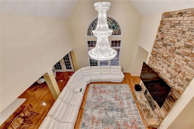 3565 Hickory Branch Trl, Suwanee, GA 30024 - foyer entrance featuring a chandelier, high vaulted ceiling, wood finished floors, and baseboards