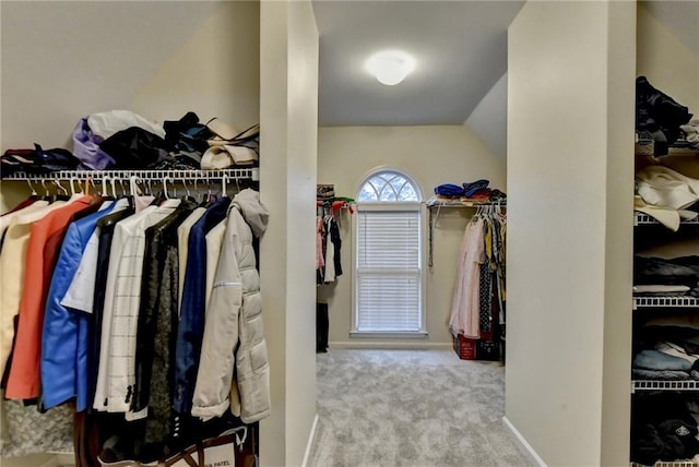 3565 Hickory Branch Trl, Suwanee, GA 30024 - walk in closet featuring carpet and lofted ceiling