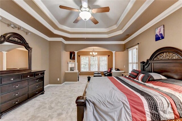 3565 Hickory Branch Trl, Suwanee, GA 30024 - bedroom with ornate columns, arched walkways, a chandelier, a tray ceiling, and light colored carpet
