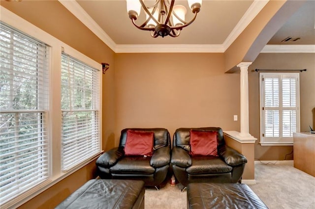 3565 Hickory Branch Trl, Suwanee, GA 30024 - sitting room featuring decorative columns, plenty of natural light, carpet flooring, a chandelier, and ornamental molding