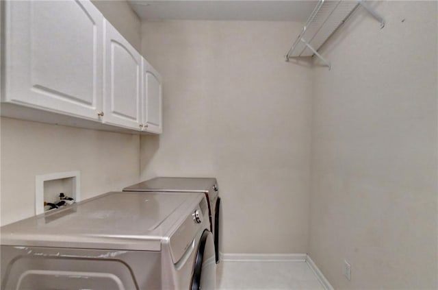 3565 Hickory Branch Trl, Suwanee, GA 30024 - laundry area featuring cabinet space, baseboards, and washing machine and dryer