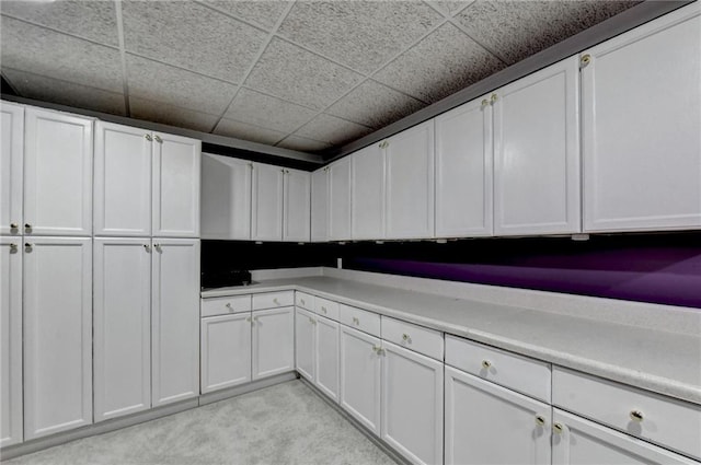 3565 Hickory Branch Trl, Suwanee, GA 30024 - kitchen featuring white cabinets, light countertops, and light carpet
