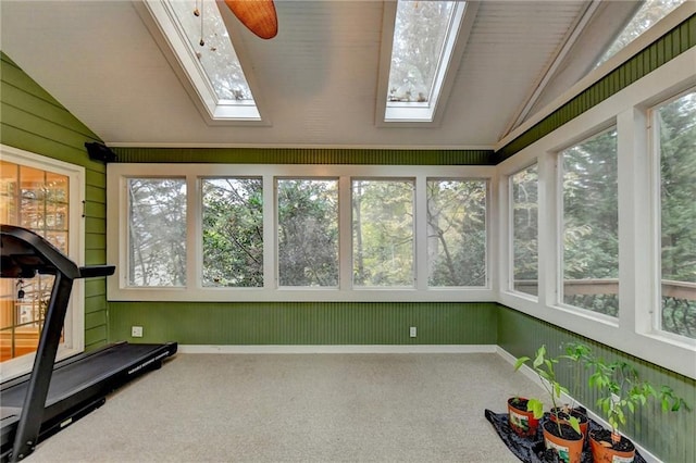 3565 Hickory Branch Trl, Suwanee, GA 30024 - unfurnished sunroom featuring a skylight, lofted ceiling, carpet flooring, healthy amount of natural light, and wood walls