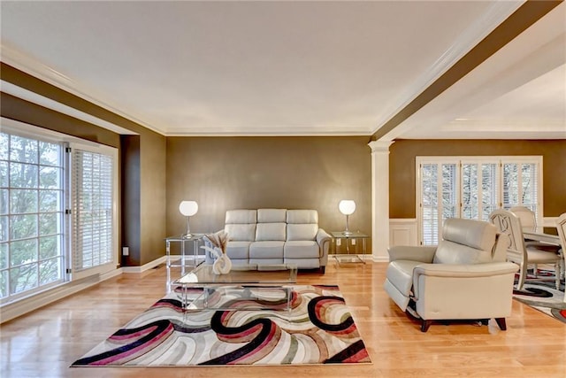 3565 Hickory Branch Trl, Suwanee, GA 30024 - living area with wood finished floors, decorative columns, ornamental molding, and a wainscoted wall