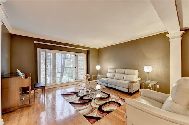 3565 Hickory Branch Trl, Suwanee, GA 30024 - living area with decorative columns, hardwood / wood-style flooring, crown molding, and baseboards