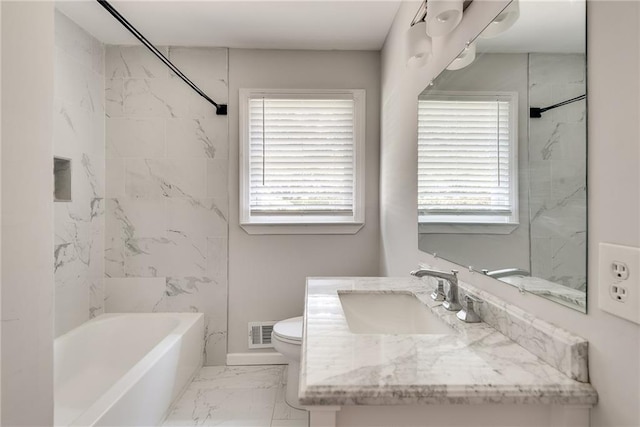 bathroom featuring marble finish floor, visible vents, plenty of natural light, and toilet