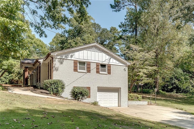 view of home's exterior featuring driveway, a garage, a yard, board and batten siding, and brick siding