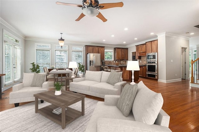 5575 Julian Pl, Atlanta, GA 30342 - living area with ornamental molding, plenty of natural light, wood finished floors, ceiling fan, and stairs