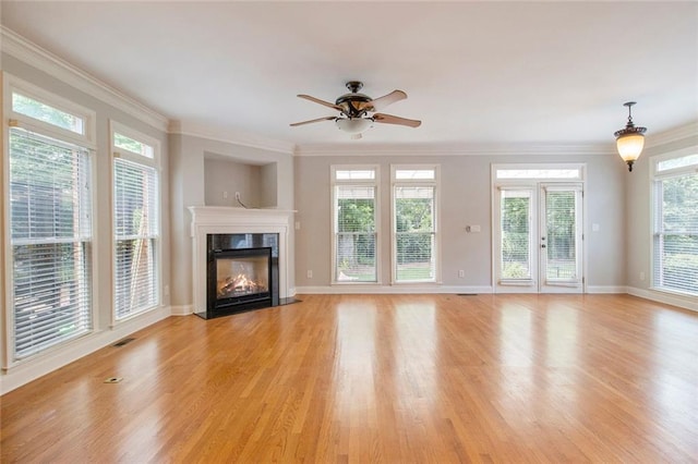 5575 Julian Pl, Atlanta, GA 30342 - unfurnished living room with light wood-style floors, ornamental molding, a high end fireplace, and a ceiling fan