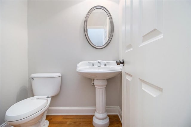 5575 Julian Pl, Atlanta, GA 30342 - bathroom with toilet and wood finished floors