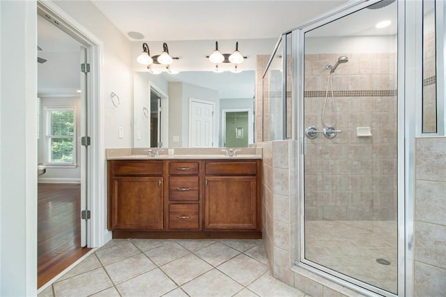 5575 Julian Pl, Atlanta, GA 30342 - bathroom with a stall shower, double vanity, and tile patterned flooring