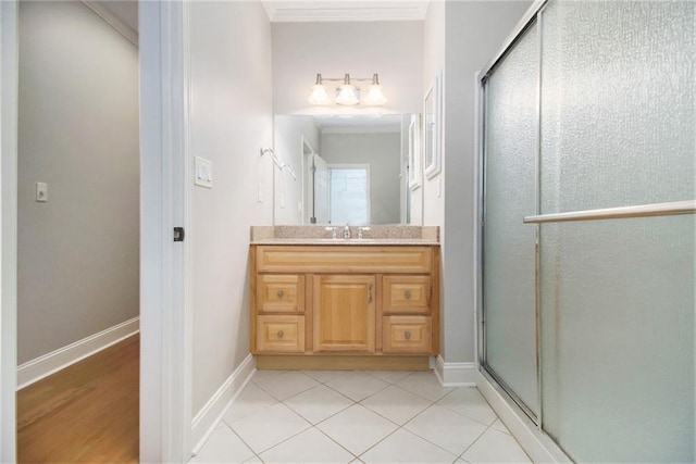 5575 Julian Pl, Atlanta, GA 30342 - full bathroom with vanity, a stall shower, crown molding, and tile patterned flooring
