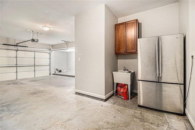5575 Julian Pl, Atlanta, GA 30342 - garage featuring freestanding refrigerator and a garage door opener