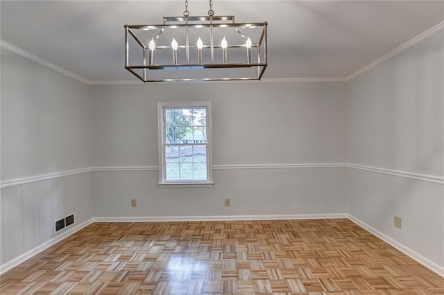 spare room featuring a chandelier, visible vents, and crown molding