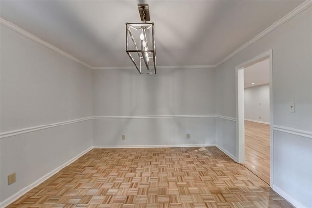 spare room featuring crown molding, a notable chandelier, and baseboards