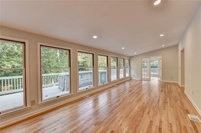 unfurnished living room featuring baseboards, light wood-type flooring, visible vents, and recessed lighting