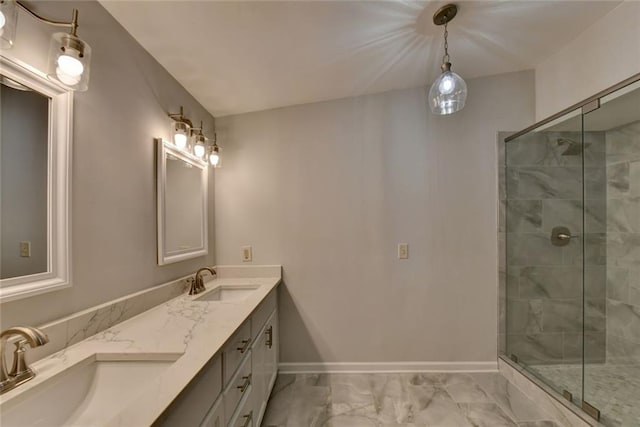 full bath featuring a stall shower, baseboards, and a sink