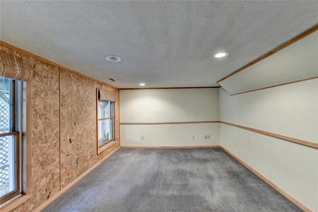 carpeted empty room with recessed lighting, visible vents, crown molding, and baseboards