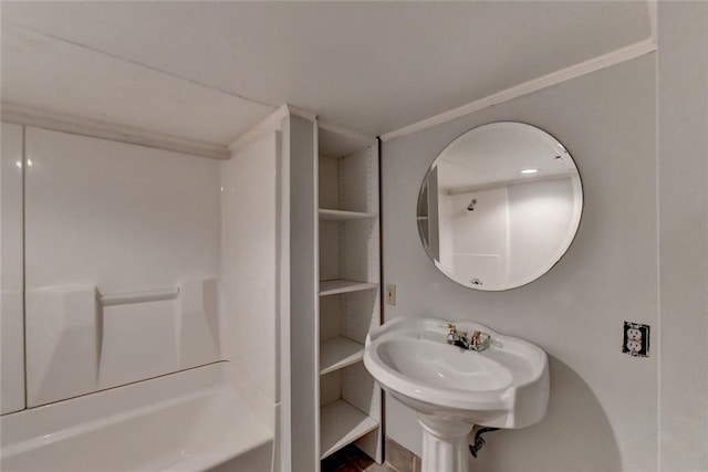 full bath with a sink, washtub / shower combination, and crown molding