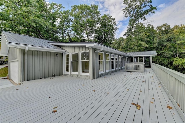 wooden deck featuring a garage