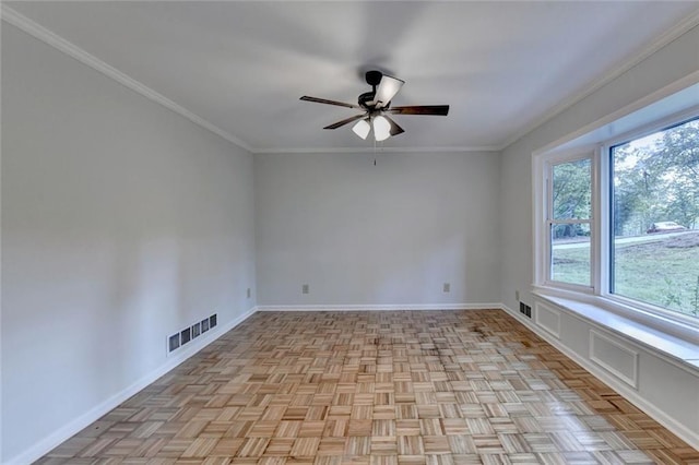 empty room featuring a ceiling fan, baseboards, visible vents, and crown molding