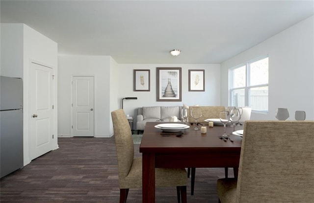 dining area featuring dark wood finished floors