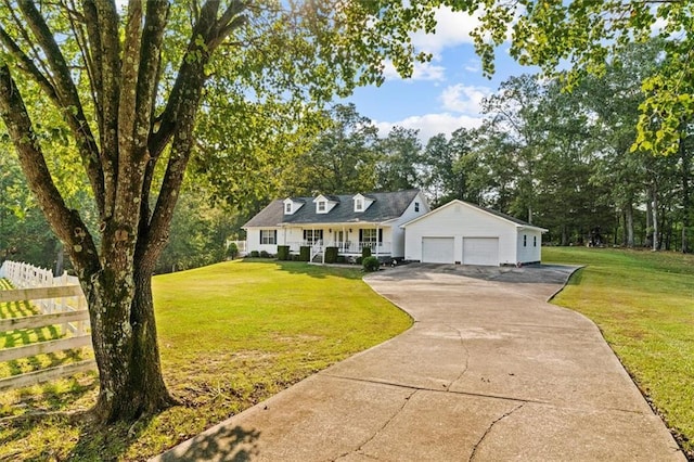 cape cod house with a porch, a front lawn, an attached garage, and fence