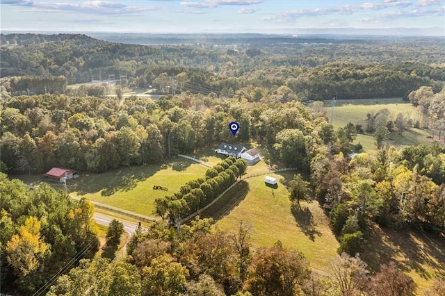 drone / aerial view with a forest view and a rural view