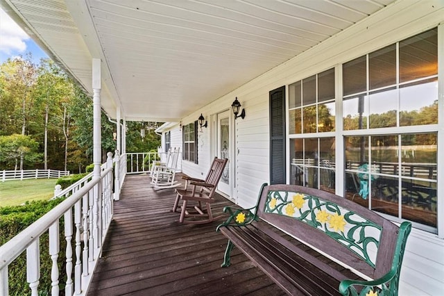 wooden terrace featuring covered porch