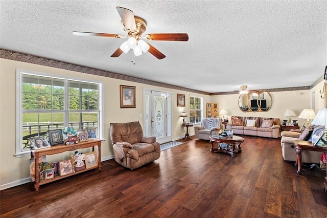 living room featuring ceiling fan, a textured ceiling, and wood finished floors