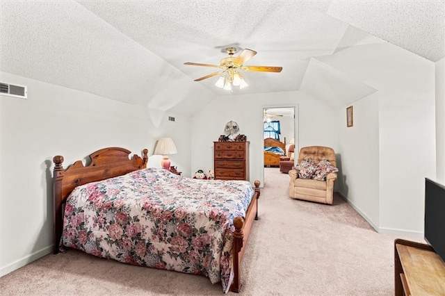 bedroom featuring baseboards, visible vents, lofted ceiling, a textured ceiling, and carpet flooring