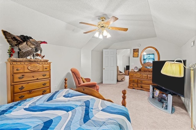 bedroom featuring ceiling fan, a textured ceiling, vaulted ceiling, and carpet flooring