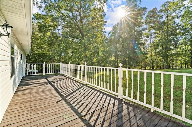 wooden terrace with a yard