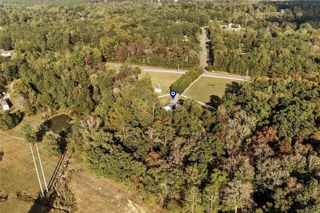 bird's eye view featuring a wooded view