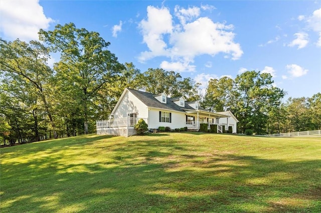 exterior space featuring a front yard and fence