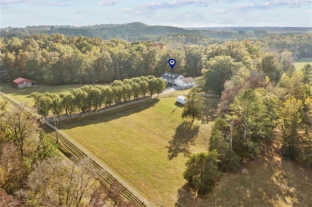 bird's eye view featuring a rural view and a wooded view