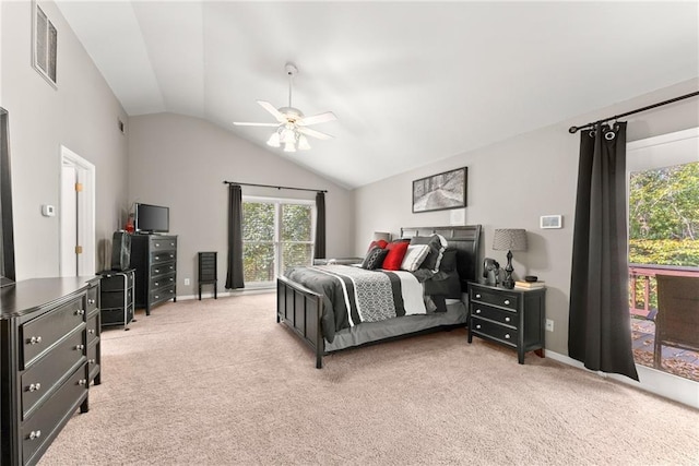 bedroom featuring vaulted ceiling, light colored carpet, and ceiling fan